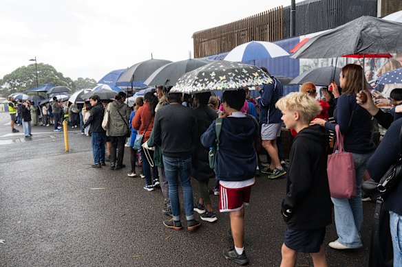 Parents and children queue at Randwick Racecourse for the selective schools test in May.