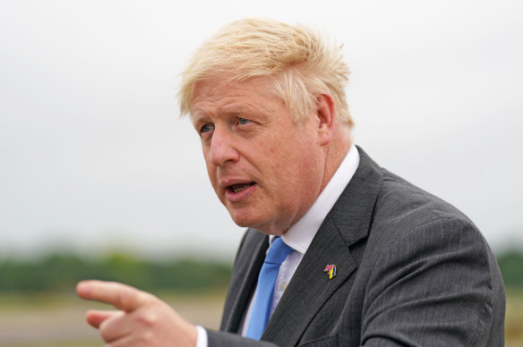 British Prime Minister Boris Johnson speaks to media at an RAF base on Saturday.