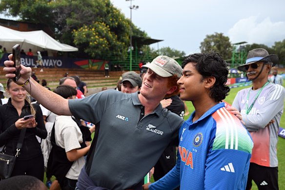 Vaibhav Suryavanshi poses with a fan at the under-19 World Cup.