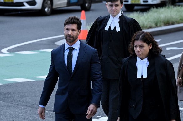 Heston Russell (left) with barristers Sue Chrysanthou, SC, and Nicholas Olson (back).