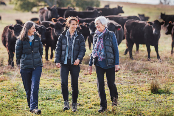 Annabel Johnson, centre, on the family farm in 2019 with her mother, Claire, left, and her grandmother Marg, right.