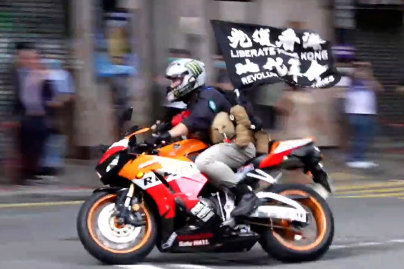 Tong Ying-kit riding his motorcycle during the protest in Hong Kong.