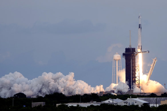 A SpaceX Falcon 9 rocket, with the Dragon capsule and a crew of four private astronauts lifts off from pad 39A, at the Kennedy Space Center in Cape Canaveral.