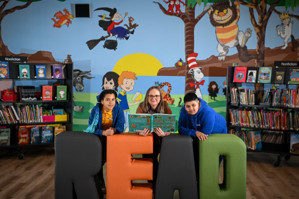 Merri-bek Primary School library resource manager Helen Brown with student leaders Sonquette (left) and Shaurya.