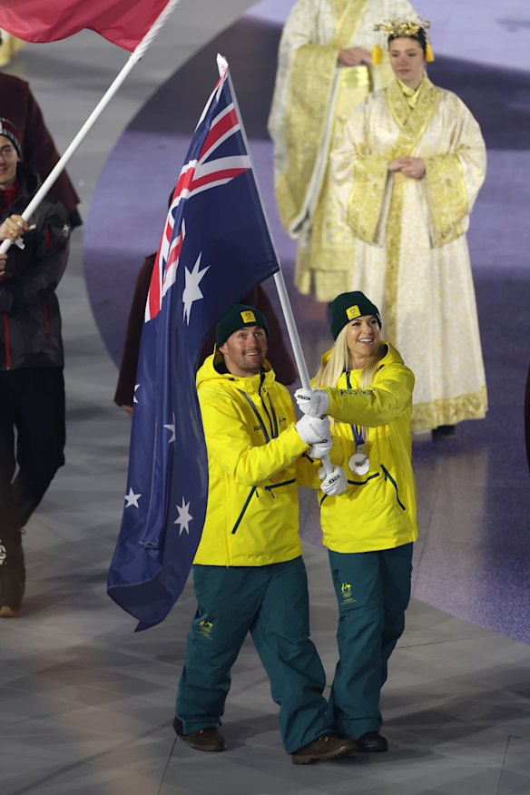 Cooper Woods and Danielle Scott fulfil their duties as Australian flag-bearers.