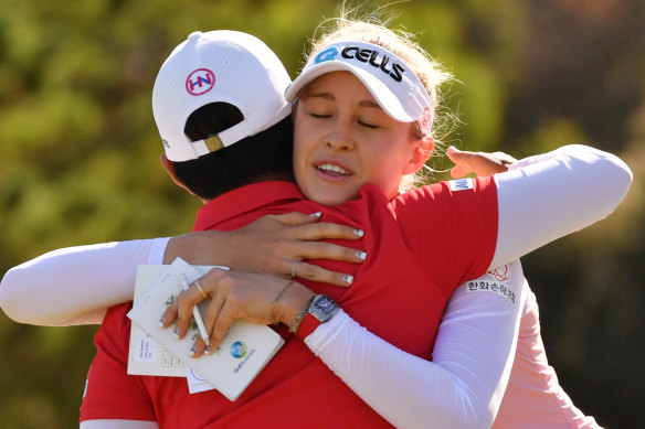 Nelly Korda from the USA and Haru Nomura of Japan after the end of play on day 3 of the Women's Australian Open.