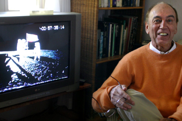 Peter Clifton at his home with a video of the moon landing, 2006. 