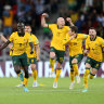 Awer Mabil (11) celebrates the Socceroos’ shoot-out victory over Peru.