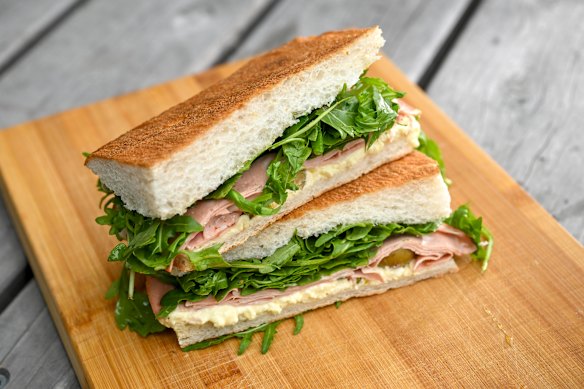 The mortadella panino with layers of lunchmeat, stracciatella cheese, rocket, green olives, honey and pistachio.