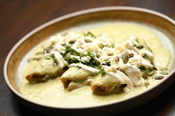 Chicken enchiladas in an almost fluffy green salsa.