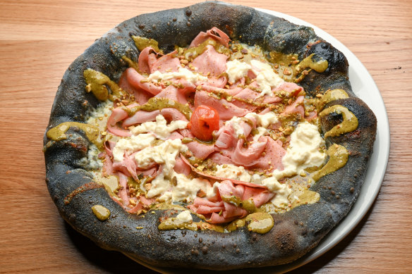 Mortadella pizza on a charcoal dough base.