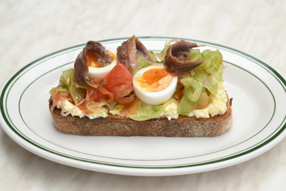 Anchovy toast with stracciatella, wood-fired peppers, shaved
tomato, pickled shallots and soft-boiled egg.