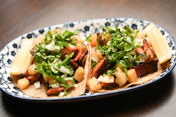 Tacos al pastor with pork and pineapple.