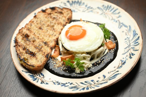 Tamal with mole is served at brunch (with fried egg, pictured) and dinner (with chicken).