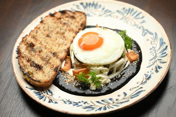 Tamal with mole is served at brunch (with fried egg, pictured) and dinner (with chicken).