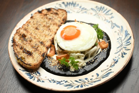 Tamal with mole is served at brunch (with fried egg, pictured) and dinner (with chicken).