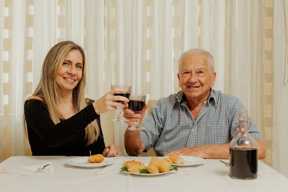 Jessica Timpano and her father, Bart Nicoliello, enjoy home-made croquettes and wine.