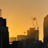 wo hot air balloons travel through the smoky haze blanketing the city skyline ahead of a forecast temperature of 45 degrees in Melbourne today. 