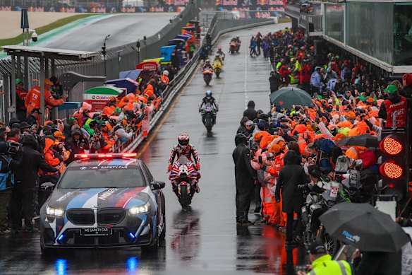 Riders during a lap to say goodbye to crowd after the race was cancelled due to bad weather. Australian Motorcycle Grand Prix 2026. This year’s event marks the 30th and final MotoGP race held at Phillip Island Grand Prix Circuit.