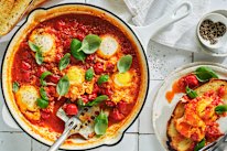  Danielle Alvarez's tomato and basil poached eggs with crusty bread.