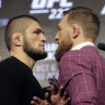 Returning McGregor promotes fight, whisky at raucous press conference