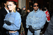 Double denim has Kanye West spreading love in Paris at the Kenzo show, with girlfriend Julia Fox.