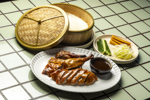 Dry-aged half duck with cucumber, spicy hoisin and pancakes.