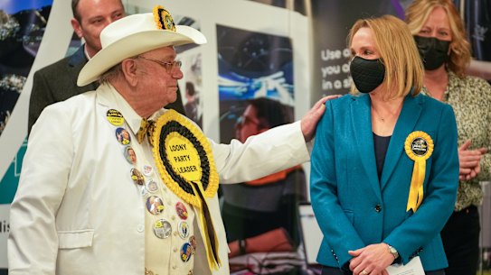 Alan ‘Howling Laud’ Hope, Official Monster Raving Loony Party, congratulates North Shropshire by-election winner Helen Morgan of the Liberal Democrats in Shrewsbury, England, on Friday.