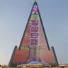 World's tallest uncompleted hotel lights up with North Korean propaganda