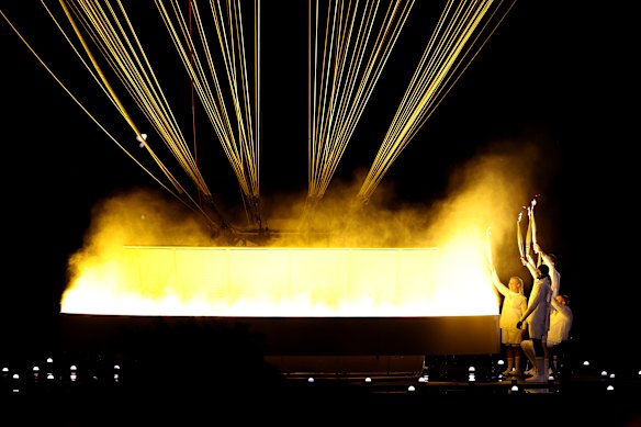 Torchbearers Charles Antoine Kouakou, Fabien Lamirault, Elodie Lorandi, Nantenin Keita and Alexis Hanquinquant light the cauldron.