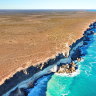 Drone image of the Bunda Cliffs, where the Nullarbor Plain meets the Great Australian Bight. Layering in the cliffs represent different limestone units. 
