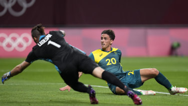 Lachlan Wales throws himself forward to score for the Olyroos against Argentina. 