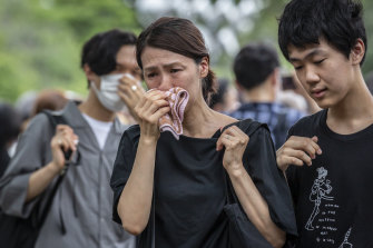 A woman reacts outside the funeral for former Japanese Prime Minister Shinzo Abe on Tuesday.