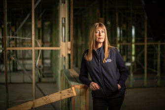 Master Builders Victoria chief executive officer Rebecca Casson on a building site at Lovely Banks, on the outskirts of Geelong. 