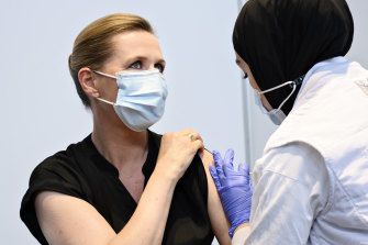 Danish Prime Minister Mette Frederiksen is vaccinated against COVID-19, in Copenhagen, Denmark, in June.