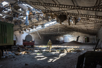 Utter destruction: A Ukrainian army officer inspects a grain warehouse shelled by Russian forces. Russia’s war on Ukraine combined with another bout of La Niña could set off a global food emergency.