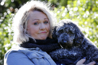 Prue Bamford with her dog Lux. She is no longer licensed to care for wildlife because of conflict with her local group.