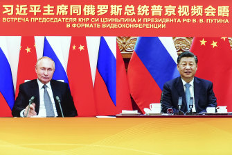 Chinese President Xi Jinping, right, and Russian President Vladimir Putin at their summit on Thursday (AEDT). Xi supported Putin in his push to get Western security guarantees precluding NATO’s eastward expansion, the Kremlin said. 