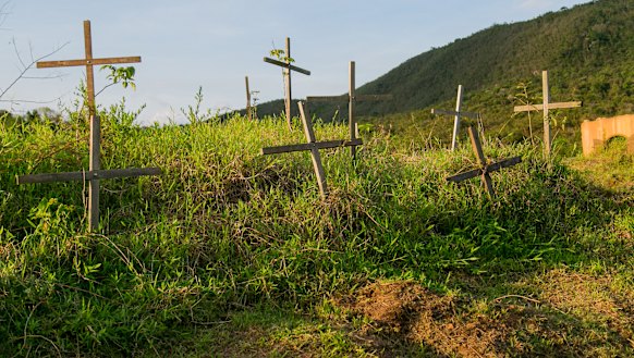 Crosses mark the lives lost at Bento Rodrigues.