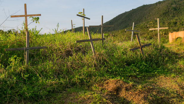 Crosses remember the dead of the Samarco dam disaster in the now deserted village of Bento Rodrigues, Brazil. 