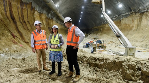 Transport Minister Andrew Constance, Premier Gladys Berejiklian and Transport for NSW Secretary Rodd Staples at the Barangaroo metro construction on Thursday. 