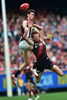 Magpies player Tyson Goldsack and the Bombers' Martin Gleeson contest.