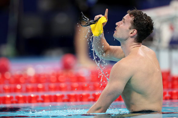 Ben Hance points to the sky after his gold medal swim. 