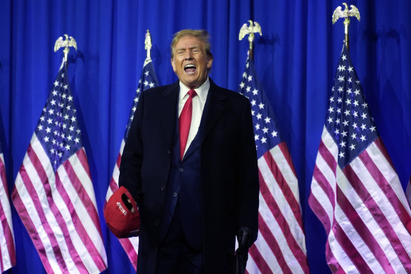 Republican candidate former president Donald Trump yells on stage at a campaign rally.