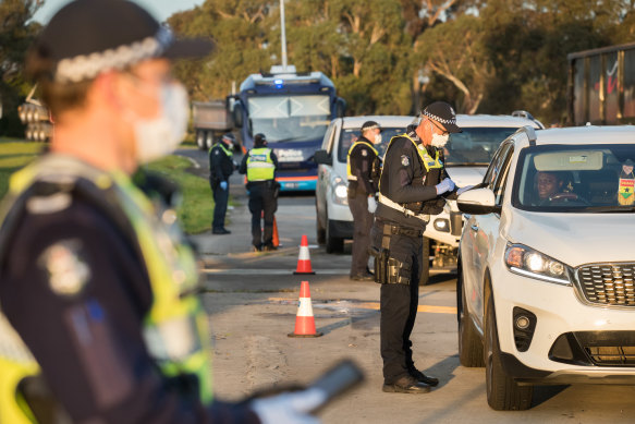 Police at a road block on the Hume Highway in Kalkallo