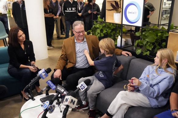 Brianne and Colin, children of firefighter Billy Moon, listen to the beating of their father’s heart inside transplant recipient Richard Grehl for the first time at the offices of LiveOnNY in New York earlier this month.