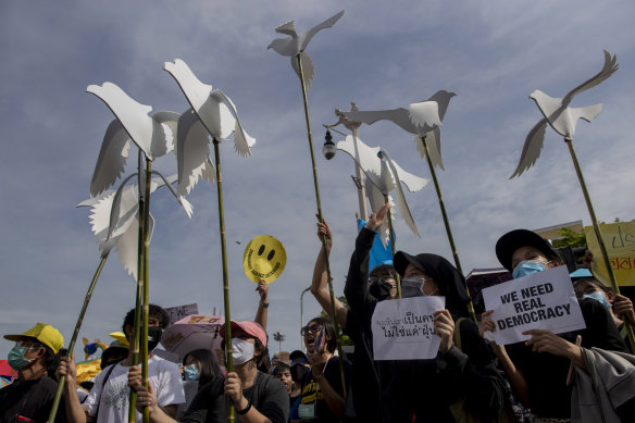 Pro-democracy activists display placards during a protest at Democracy Monument in Bangkok, Thailand, on Sunday.