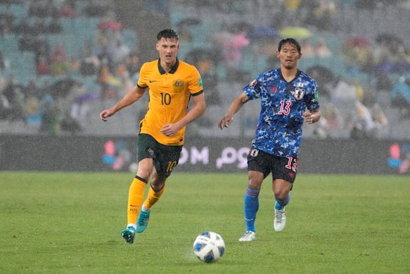 Ajdin Hrustic and Hidemasa Morita compete for the ball.