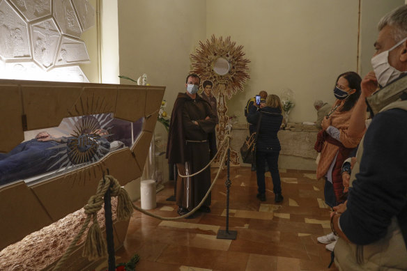 Carlo Acutis lies in state ahead of being beatified in Assisi in 2020, on the road to sainthood.