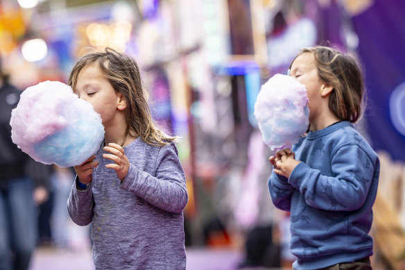 Kids enjoy fairy floss at the show on Thursday. 